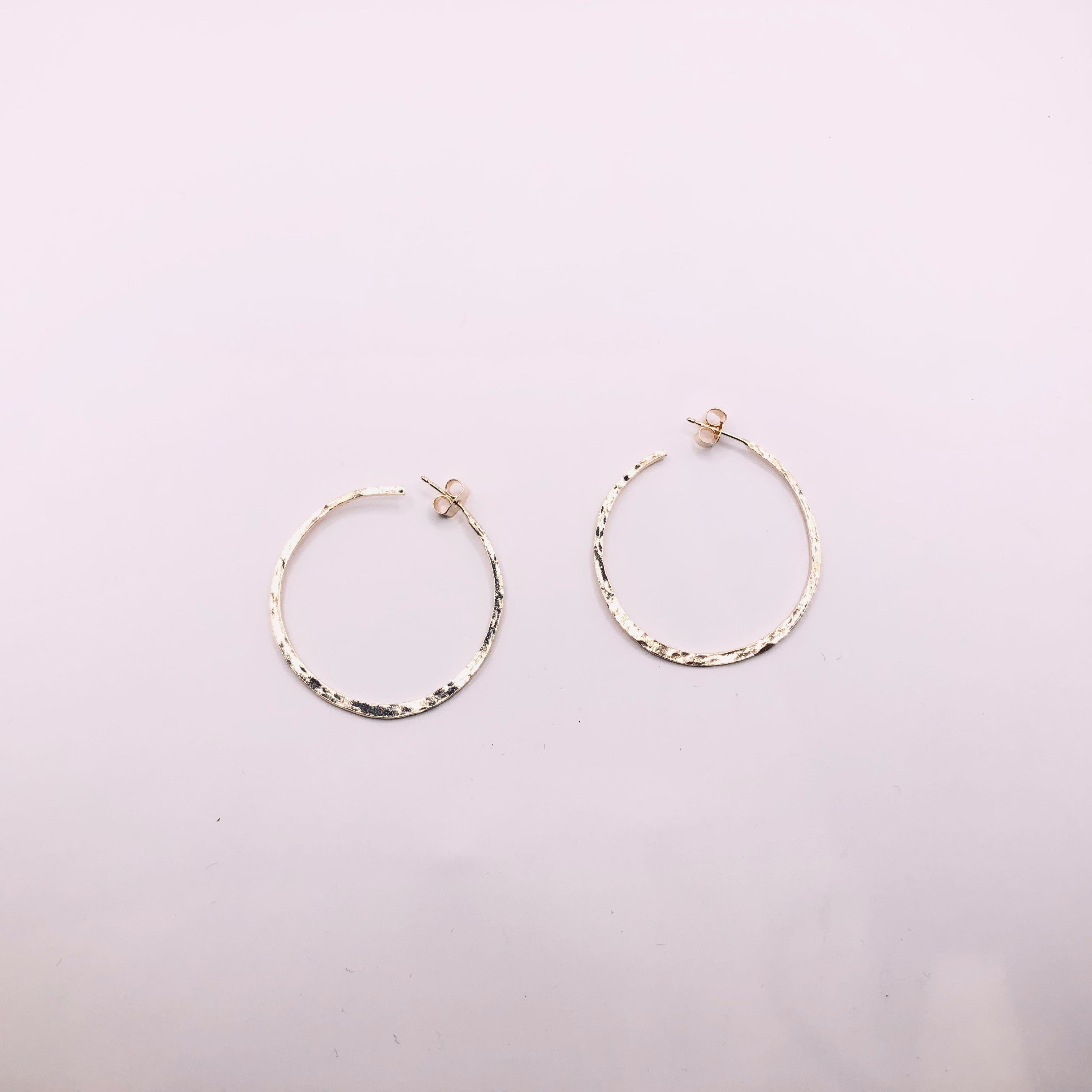 Open medium hammered silver/gold plated gypsy earrings.