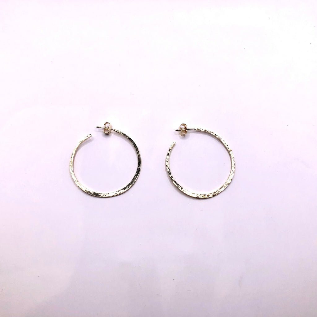 Open medium hammered silver/gold plated gypsy earrings.